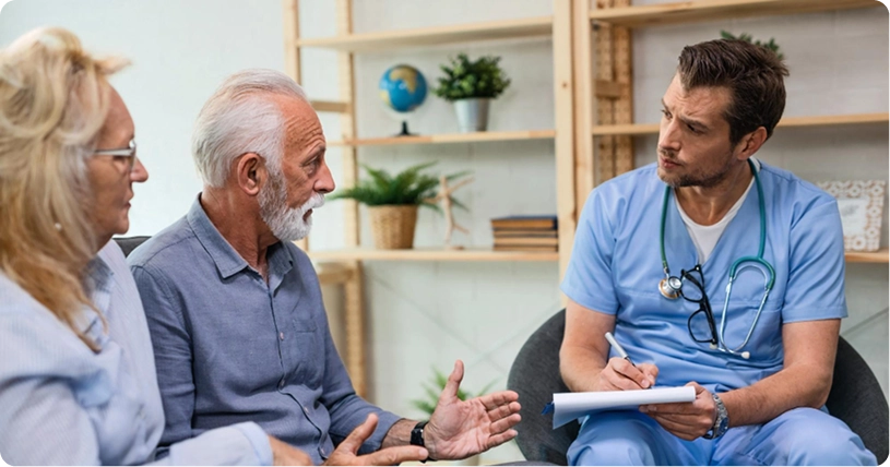 Home care consultation with caregiver and senior couple