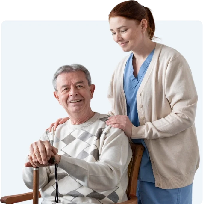 Caregiver sitting with senior woman at home