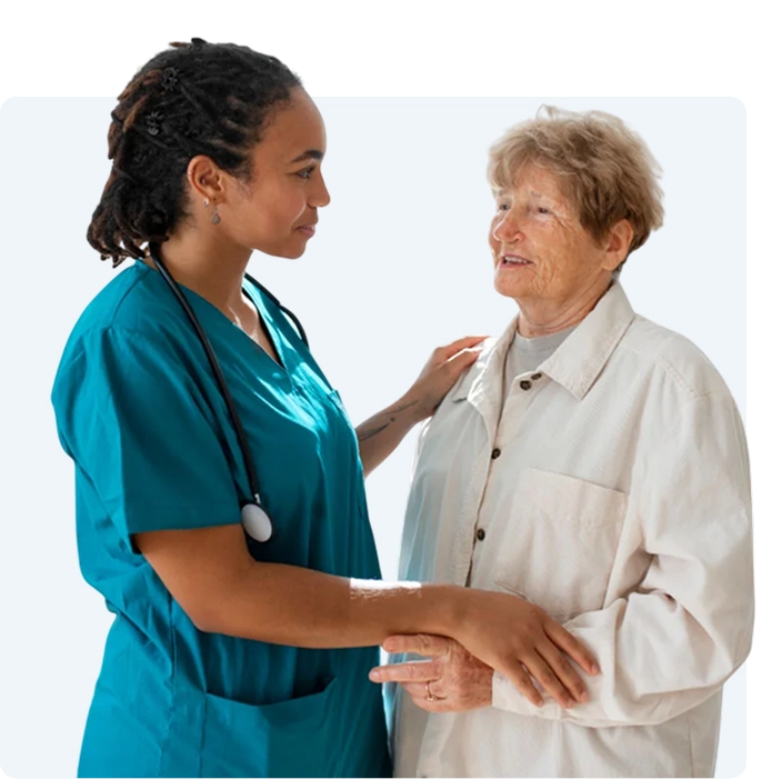 Caregiver sitting with senior woman at home