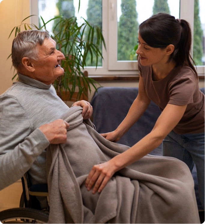 Caregiver supporting senior man at home